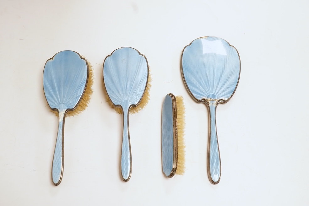 A George V silver and blue guilloche enamel four piece mirror and brush set, Adie Bros. Birmingham, 1935, mirror 28.8cm. Condition - poor